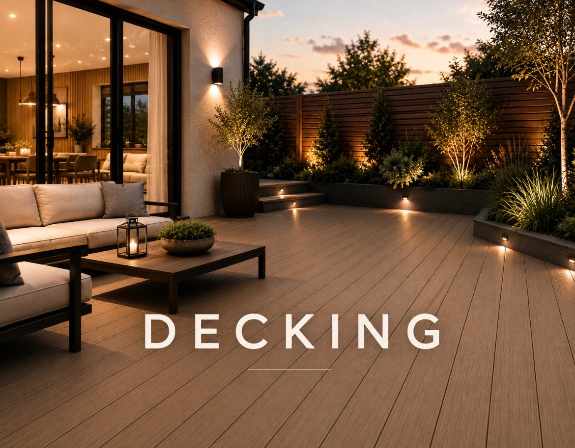 Decking - premium composite decking with outdoor lounge furniture and landscaped garden at dusk